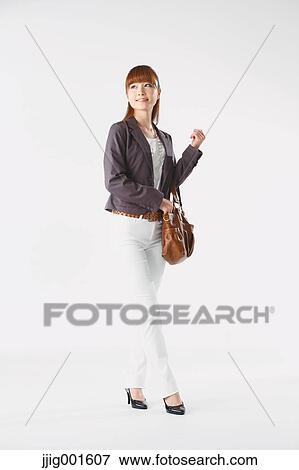 Full length portrait of Japanese young businesswoman against white background View Large Photo Image Stock Photo - Full length portrait of Japanese young businesswoman against white background. Fotosearch