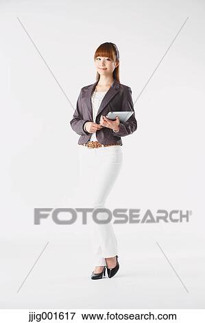 Full length portrait of Japanese young businesswoman against white background View Large Photo Image Stock Photo - Full length portrait of Japanese young businesswoman against white background. Fotosearch