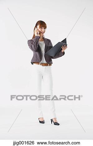 Full length portrait of Japanese young businesswoman against white background View Large Photo Image Stock Photograph - Full length portrait of Japanese young businesswoman against white background. Fotosearch