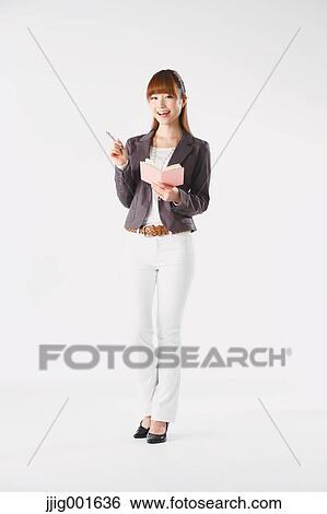 Full length portrait of Japanese young businesswoman against white background View Large Photo Image Stock Photograph - Full length portrait of Japanese young businesswoman against white background. Fotosearch