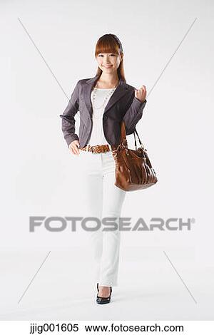 Full length portrait of Japanese young businesswoman against white background View Large Photo Image Stock Photography - Full length portrait of Japanese young businesswoman against white background. Fotosearch