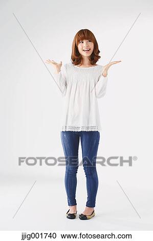Full length portrait of young Japanese woman against white background View Large Photo Image Stock Image - Full length portrait of young Japanese woman against white background. Fotosearch