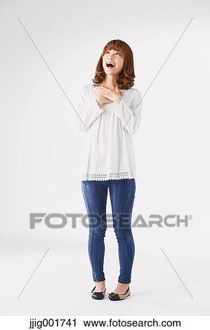 Full length portrait of young Japanese woman against white background View Large Photo Image Stock Image - Full length portrait of young Japanese woman against white background. Fotosearch