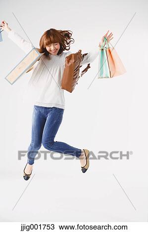 Full length portrait of young Japanese woman against white background View Large Photo Image Stock Image - Full length portrait of young Japanese woman against white background. Fotosearch