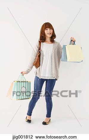 Full length portrait of young Japanese woman against white background View Large Photo Image Stock Image - Full length portrait of young Japanese woman against white background. Fotosearch