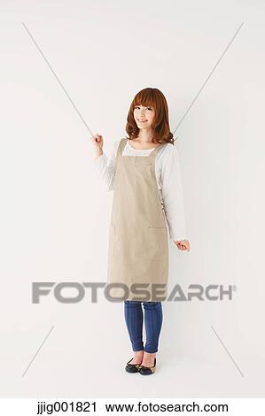 Full length portrait of young Japanese woman against white background View Large Photo Image Stock Image - Full length portrait of young Japanese woman against white background. Fotosearch