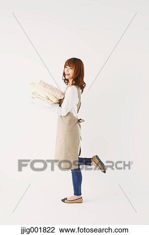 Full length portrait of young Japanese woman against white background View Large Photo Image Stock Image - Full length portrait of young Japanese woman against white background. Fotosearch