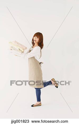 Full length portrait of young Japanese woman against white background View Large Photo Image Stock Image - Full length portrait of young Japanese woman against white background. Fotosearch