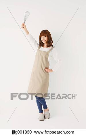 Full length portrait of young Japanese woman against white background View Large Photo Image Stock Image - Full length portrait of young Japanese woman against white background. Fotosearch