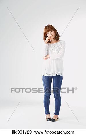 Full length portrait of young Japanese woman against white background View Large Photo Image Stock Photo - Full length portrait of young Japanese woman against white background. Fotosearch