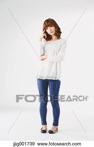 Full length portrait of young Japanese woman against white background View Large Photo Image Stock Photo - Full length portrait of young Japanese woman against white background. Fotosearch