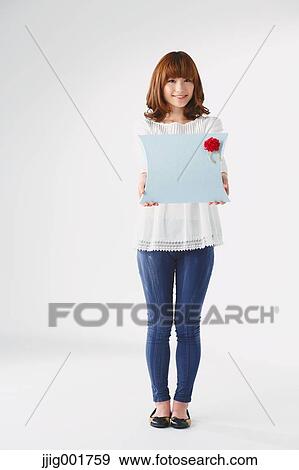 Full length portrait of young Japanese woman against white background View Large Photo Image Stock Photo - Full length portrait of young Japanese woman against white background. Fotosearch