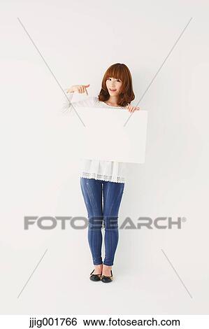 Full length portrait of young Japanese woman against white background View Large Photo Image Stock Photograph - Full length portrait of young Japanese woman against white background. Fotosearch