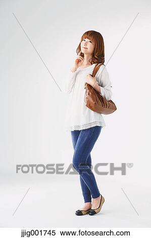 Full length portrait of young Japanese woman against white background View Large Photo Image Stock Photography - Full length portrait of young Japanese woman against white background. Fotosearch