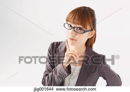 Picture - Half length portrait of Japanese young businesswoman against white background. Fotosearch