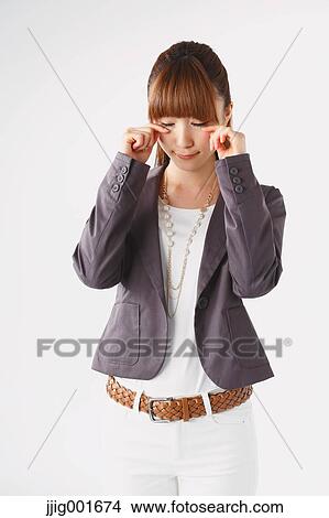 Half length portrait of Japanese young businesswoman against white background View Large Photo Image Picture - Half length portrait of Japanese young businesswoman against white background. Fotosearch