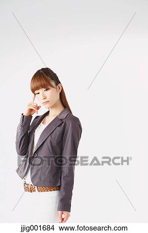 Half length portrait of Japanese young businesswoman against white background View Large Photo Image Picture - Half length portrait of Japanese young businesswoman against white background. Fotosearch