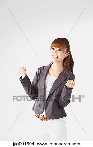 Half length portrait of Japanese young businesswoman against white background View Large Photo Image Picture - Half length portrait of Japanese young businesswoman against white background. Fotosearch