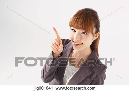 Half length portrait of Japanese young businesswoman against white background View Large Photo Image Stock Image - Half length portrait of Japanese young businesswoman against white background. Fotosearch