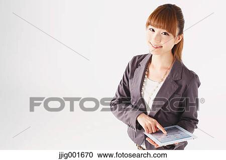 Half length portrait of Japanese young businesswoman against white background View Large Photo Image Stock Image - Half length portrait of Japanese young businesswoman against white background. Fotosearch