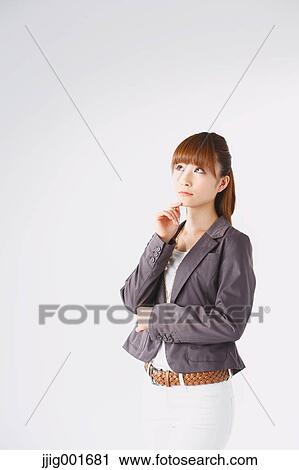 Half length portrait of Japanese young businesswoman against white background View Large Photo Image Stock Image - Half length portrait of Japanese young businesswoman against white background. Fotosearch