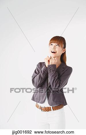Half length portrait of Japanese young businesswoman against white background View Large Photo Image Stock Image - Half length portrait of Japanese young businesswoman against white background. Fotosearch
