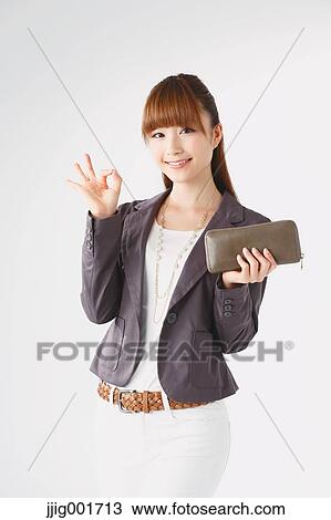 Half length portrait of Japanese young businesswoman against white background View Large Photo Image Stock Image - Half length portrait of Japanese young businesswoman against white background. Fotosearch