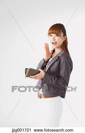 Half length portrait of Japanese young businesswoman against white background View Large Photo Image Stock Image - Half length portrait of Japanese young businesswoman against white background. Fotosearch