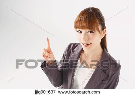 Half length portrait of Japanese young businesswoman against white background View Large Photo Image Stock Photo - Half length portrait of Japanese young businesswoman against white background. Fotosearch