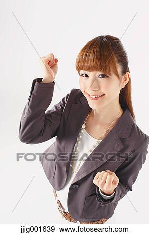 Half length portrait of Japanese young businesswoman against white background View Large Photo Image Stock Photo - Half length portrait of Japanese young businesswoman against white background. Fotosearch