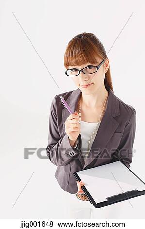Half length portrait of Japanese young businesswoman against white background View Large Photo Image Stock Photo - Half length portrait of Japanese young businesswoman against white background. Fotosearch