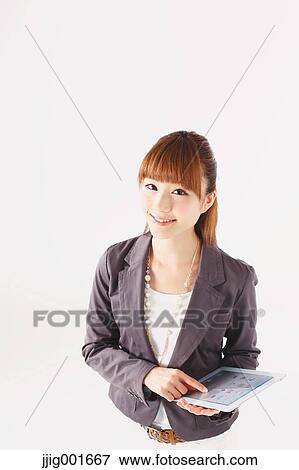 Half length portrait of Japanese young businesswoman against white background View Large Photo Image Stock Photo - Half length portrait of Japanese young businesswoman against white background. Fotosearch