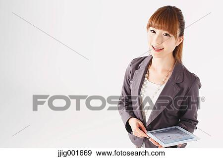 Half length portrait of Japanese young businesswoman against white background View Large Photo Image Stock Photo - Half length portrait of Japanese young businesswoman against white background. Fotosearch