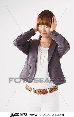 Half length portrait of Japanese young businesswoman against white background View Large Photo Image Stock Photo - Half length portrait of Japanese young businesswoman against white background. Fotosearch