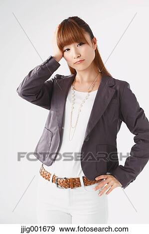 Half length portrait of Japanese young businesswoman against white background View Large Photo Image Stock Photo - Half length portrait of Japanese young businesswoman against white background. Fotosearch