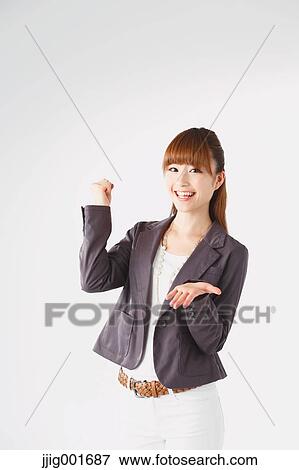 Half length portrait of Japanese young businesswoman against white background View Large Photo Image Stock Photo - Half length portrait of Japanese young businesswoman against white background. Fotosearch