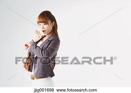 Half length portrait of Japanese young businesswoman against white background View Large Photo Image Stock Photo - Half length portrait of Japanese young businesswoman against white background. Fotosearch