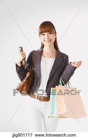Half length portrait of Japanese young businesswoman against white background View Large Photo Image Stock Photo - Half length portrait of Japanese young businesswoman against white background. Fotosearch