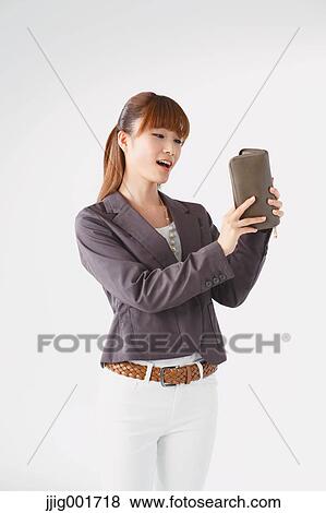 Half length portrait of Japanese young businesswoman against white background View Large Photo Image Stock Photo - Half length portrait of Japanese young businesswoman against white background. Fotosearch