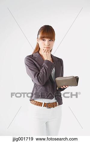 Half length portrait of Japanese young businesswoman against white background View Large Photo Image Stock Photo - Half length portrait of Japanese young businesswoman against white background. Fotosearch