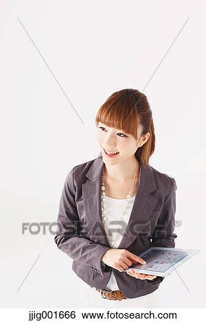 Half length portrait of Japanese young businesswoman against white background View Large Photo Image Stock Photograph - Half length portrait of Japanese young businesswoman against white background. Fotosearch
