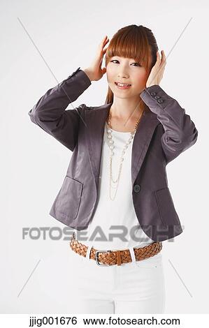Half length portrait of Japanese young businesswoman against white background View Large Photo Image Stock Photograph - Half length portrait of Japanese young businesswoman against white background. Fotosearch