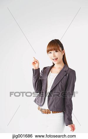 Half length portrait of Japanese young businesswoman against white background View Large Photo Image Stock Photograph - Half length portrait of Japanese young businesswoman against white background. Fotosearch