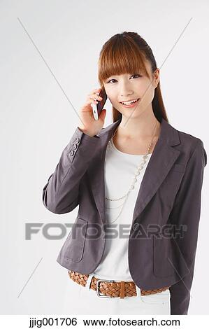 Half length portrait of Japanese young businesswoman against white background View Large Photo Image Stock Photograph - Half length portrait of Japanese young businesswoman against white background. Fotosearch