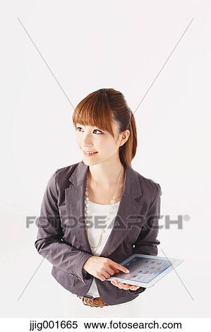 Half length portrait of Japanese young businesswoman against white background View Large Photo Image Stock Photography - Half length portrait of Japanese young businesswoman against white background. Fotosearch