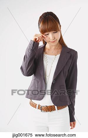 Half length portrait of Japanese young businesswoman against white background View Large Photo Image Stock Photography - Half length portrait of Japanese young businesswoman against white background. Fotosearch
