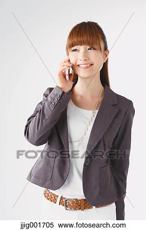 Half length portrait of Japanese young businesswoman against white background View Large Photo Image Stock Photography - Half length portrait of Japanese young businesswoman against white background. Fotosearch
