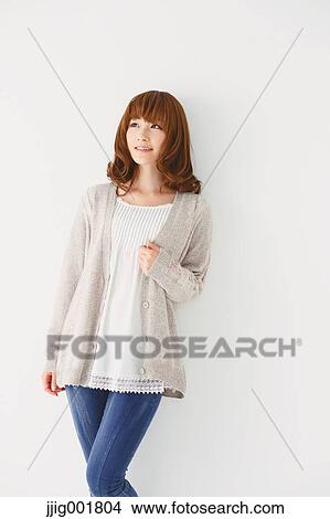 Half length portrait of young Japanese woman against white background View Large Photo Image Picture - Half length portrait of young Japanese woman against white background. Fotosearch