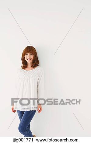 Half length portrait of young Japanese woman against white background View Large Photo Image Stock Image - Half length portrait of young Japanese woman against white background. Fotosearch