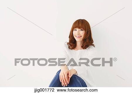 Half length portrait of young Japanese woman against white background View Large Photo Image Stock Image - Half length portrait of young Japanese woman against white background. Fotosearch